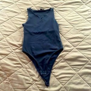 A navy blue bodysuit
